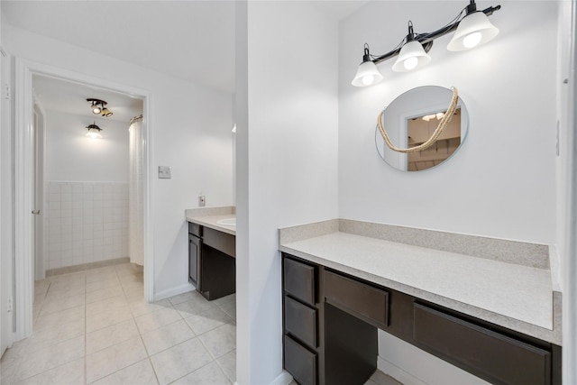 bathroom with tile patterned flooring and vanity