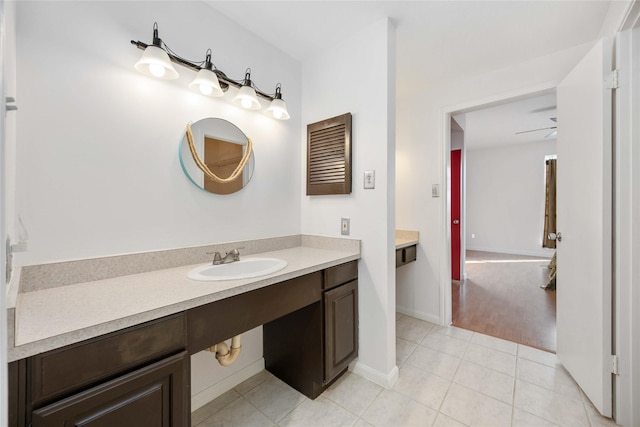 bathroom with tile patterned floors, ceiling fan, and vanity