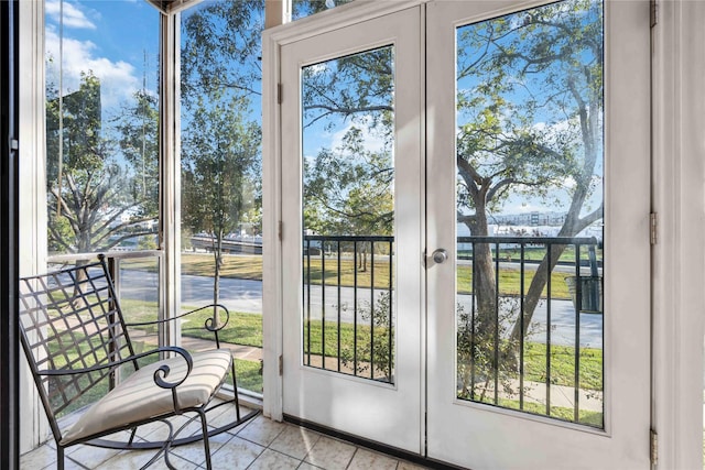 doorway with french doors and plenty of natural light