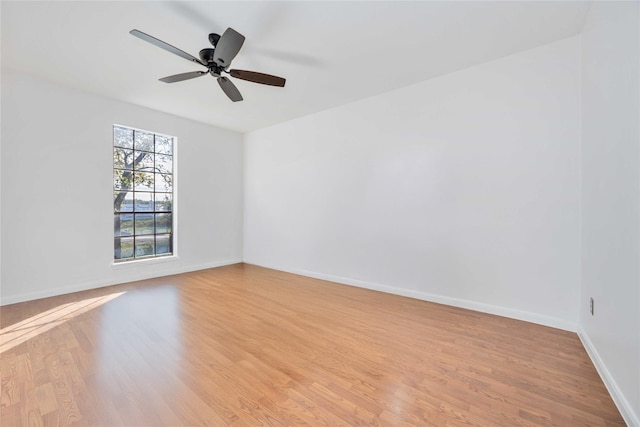 unfurnished room with ceiling fan and light hardwood / wood-style flooring