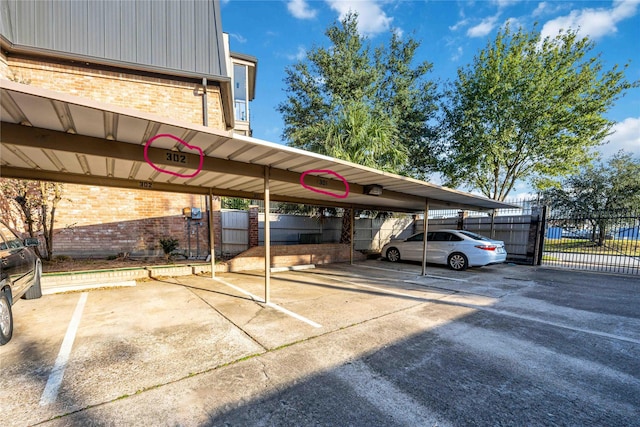 view of vehicle parking with a carport