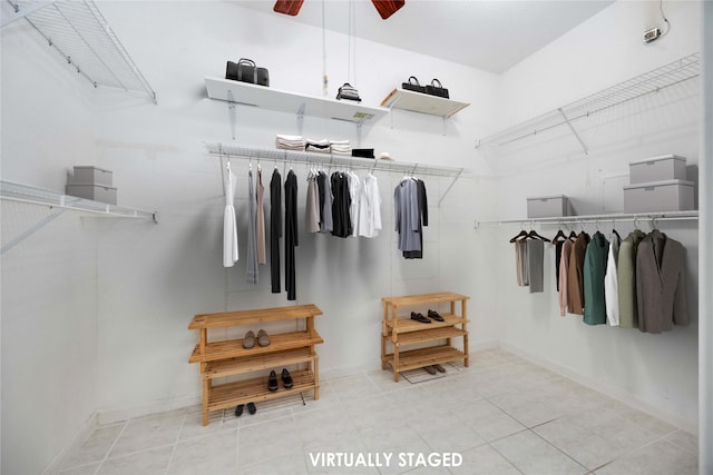 spacious closet with tile patterned floors and ceiling fan