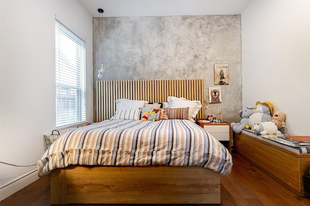 bedroom with wood finished floors