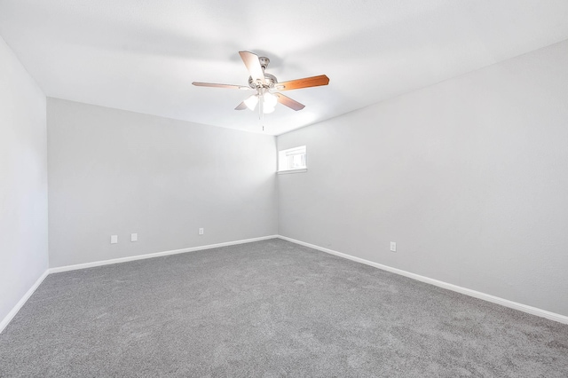 empty room featuring carpet flooring and ceiling fan