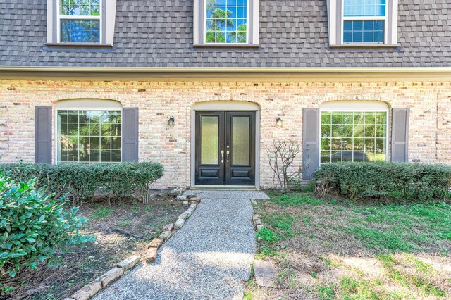 entrance to property featuring french doors