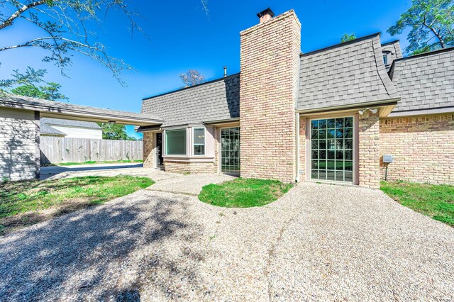 rear view of house featuring a patio area