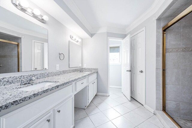 bathroom featuring vanity, tile patterned floors, an enclosed shower, and ornamental molding