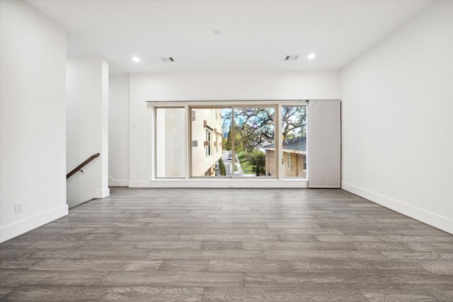 empty room featuring hardwood / wood-style floors