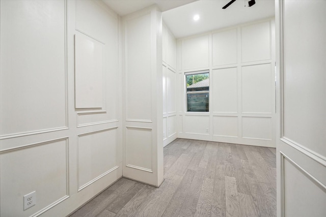 spacious closet with ceiling fan and light hardwood / wood-style floors