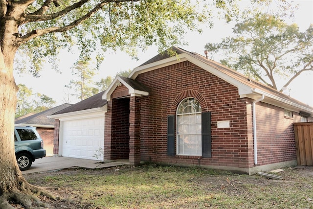 view of side of property with a garage