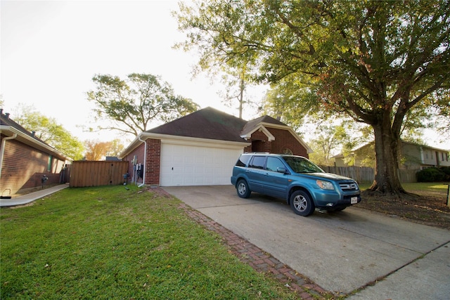 exterior space featuring a garage and a front yard