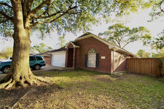 view of property exterior with a yard and a garage