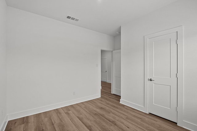 21710 Persian Lake Dr, Cypress, TX 77433 - unfurnished bedroom with visible vents, baseboards, and wood finished floors