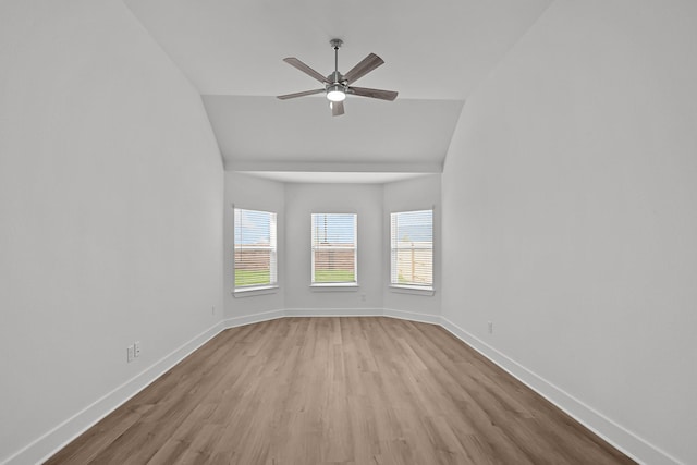 21710 Persian Lake Dr, Cypress, TX 77433 - unfurnished room featuring baseboards, ceiling fan, wood finished floors, and vaulted ceiling