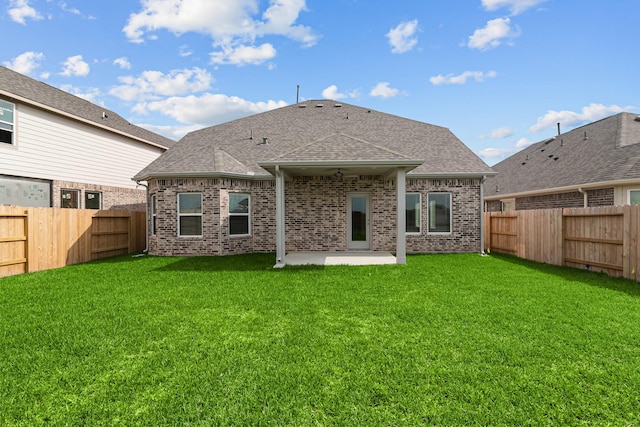 21710 Persian Lake Dr, Cypress, TX 77433 - back of house with a fenced backyard, a patio, a shingled roof, and brick siding
