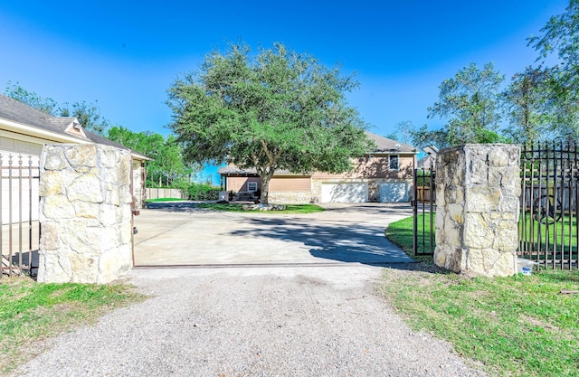 view of gate featuring a garage