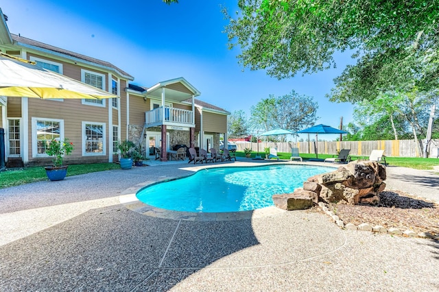 view of swimming pool featuring a patio area