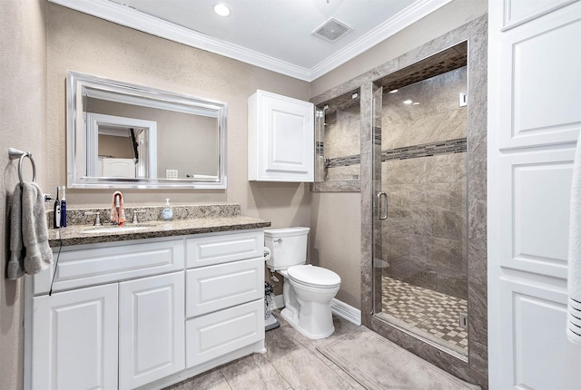 bathroom featuring toilet, vanity, a shower with shower door, and ornamental molding