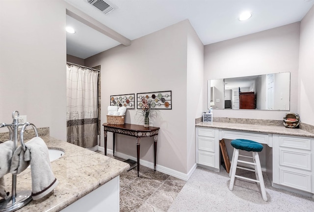 bathroom featuring vanity and walk in shower