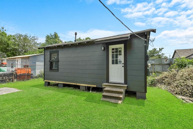 back of house with a yard