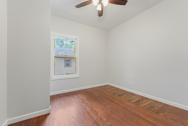 unfurnished room featuring dark hardwood / wood-style floors and ceiling fan