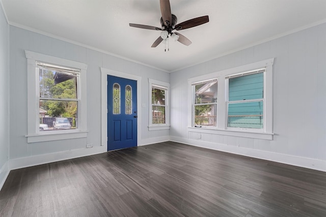 entrance foyer with plenty of natural light, dark hardwood / wood-style flooring, and crown molding