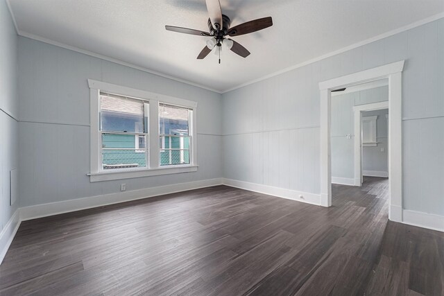 unfurnished room featuring a textured ceiling, ceiling fan, ornamental molding, and dark wood-type flooring