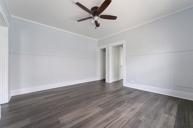 spare room featuring dark hardwood / wood-style floors, ceiling fan, and ornamental molding