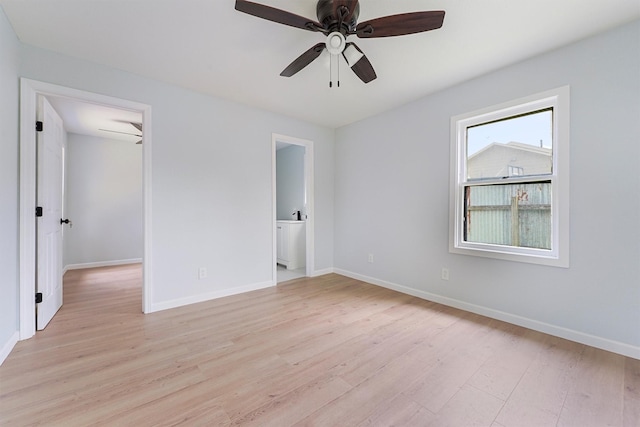 empty room featuring light wood-type flooring and ceiling fan