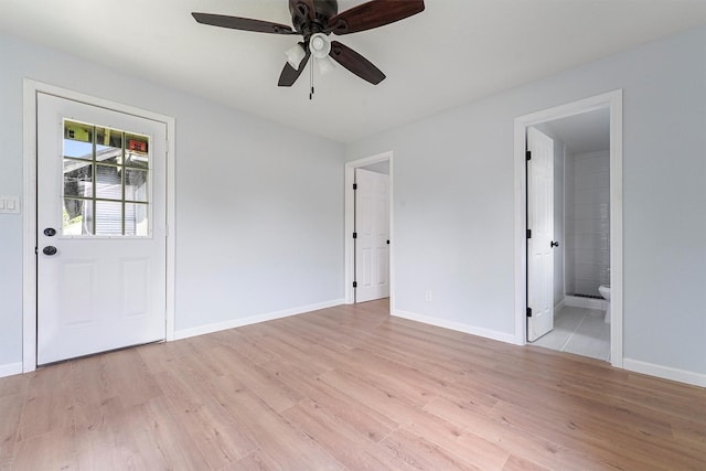 interior space with ceiling fan and light hardwood / wood-style flooring