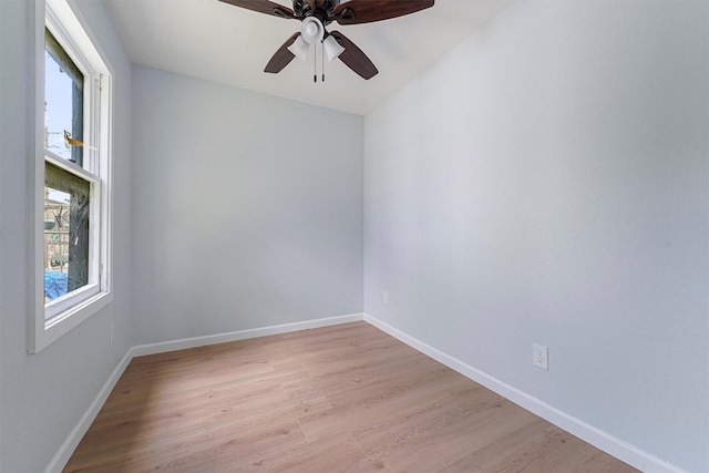 spare room featuring ceiling fan and light hardwood / wood-style flooring