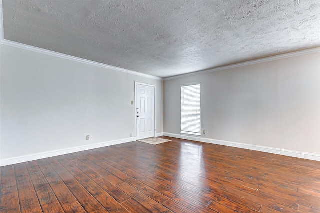 spare room with dark hardwood / wood-style floors, crown molding, and a textured ceiling