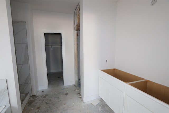 bathroom with concrete flooring