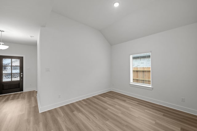 8618 Sun Coral Dr, Cypress, TX 77433 - entryway with light wood finished floors, lofted ceiling, and baseboards