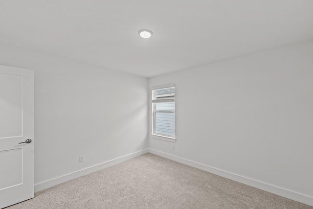8618 Sun Coral Dr, Cypress, TX 77433 - spare room featuring light carpet and baseboards