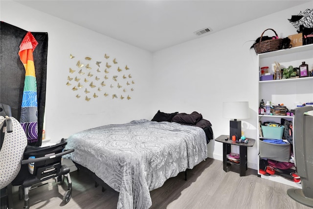 bedroom featuring hardwood / wood-style floors