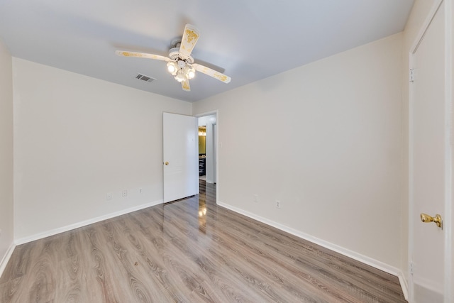 unfurnished room with ceiling fan and light hardwood / wood-style floors