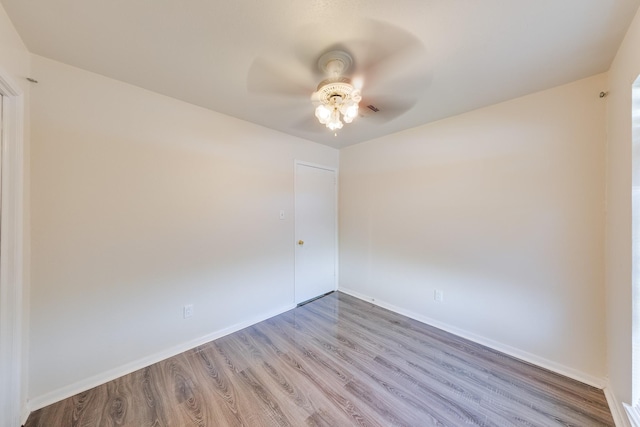 unfurnished room with hardwood / wood-style floors and ceiling fan