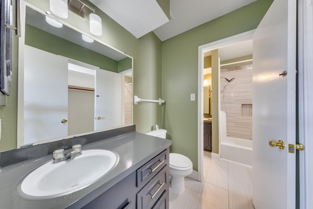 full bathroom with tile patterned floors, vanity, toilet, and tiled shower / bath