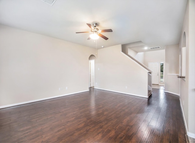 unfurnished living room with ceiling fan and dark hardwood / wood-style floors