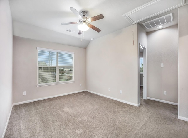 unfurnished room with ceiling fan, carpet floors, and lofted ceiling