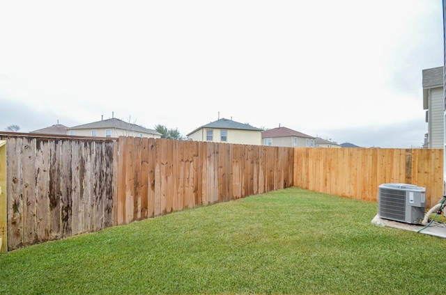 view of yard with central AC unit