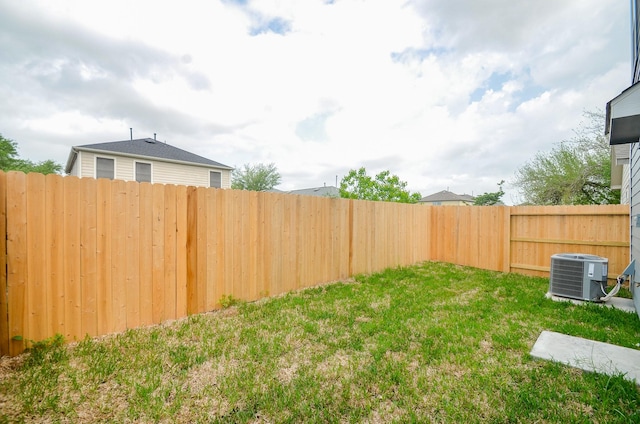 14983 Eagle Feather Dr, Houston, TX 77090 - view of yard featuring a fenced backyard and central air condition unit