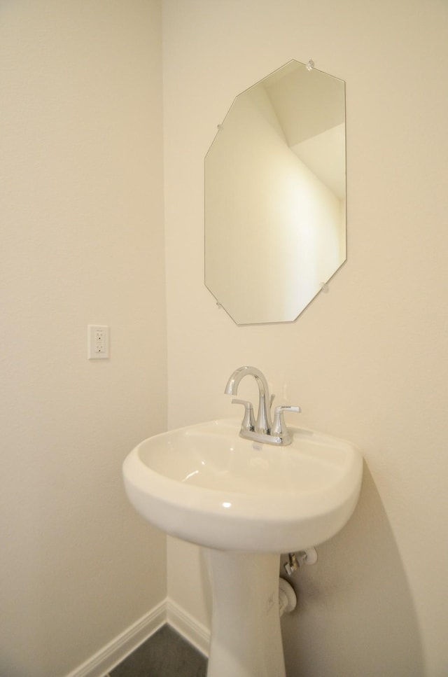14983 Eagle Feather Dr, Houston, TX 77090 - bathroom with baseboards and a sink