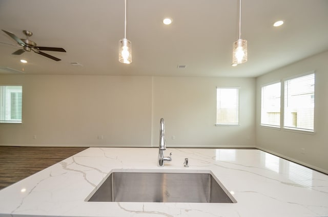 14983 Eagle Feather Dr, Houston, TX 77090 - kitchen with recessed lighting, hanging light fixtures, open floor plan, and a sink