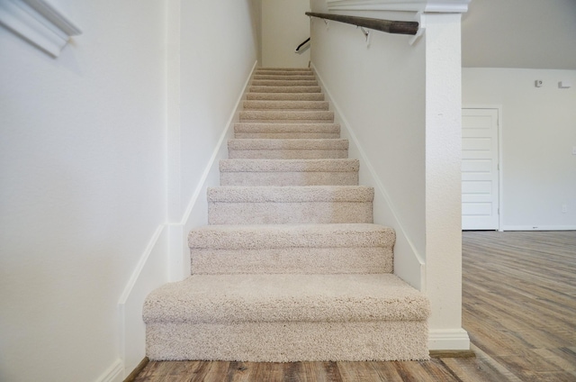 14983 Eagle Feather Dr, Houston, TX 77090 - stairway featuring baseboards and wood finished floors