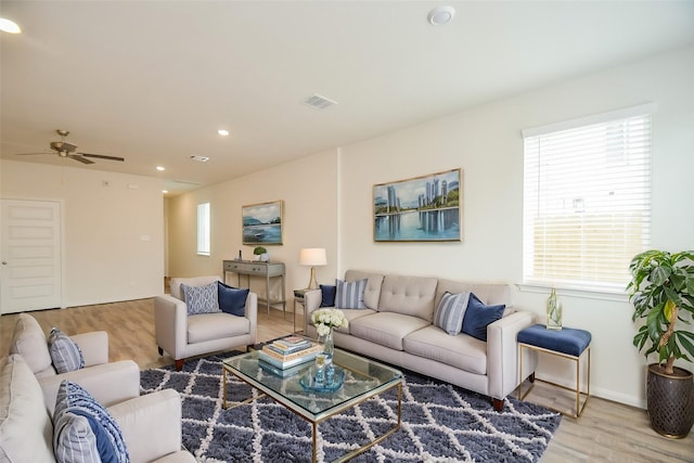 14983 Eagle Feather Dr, Houston, TX 77090 - living area featuring wood finished floors, ceiling fan, baseboards, visible vents, and recessed lighting