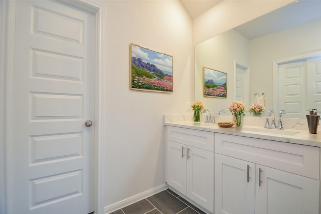 14983 Eagle Feather Dr, Houston, TX 77090 - full bath featuring baseboards, a sink, tile patterned flooring, and double vanity