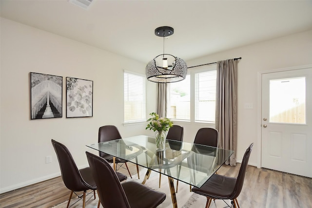 14983 Eagle Feather Dr, Houston, TX 77090 - dining area featuring wood finished floors, visible vents, and baseboards