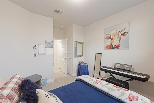 bedroom with light colored carpet